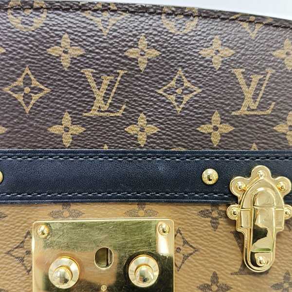 TRUNK Monogram Coated Canvas Brown