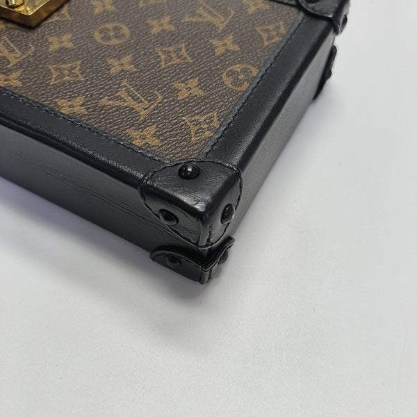TRUNK Monogram Coated Canvas Brown