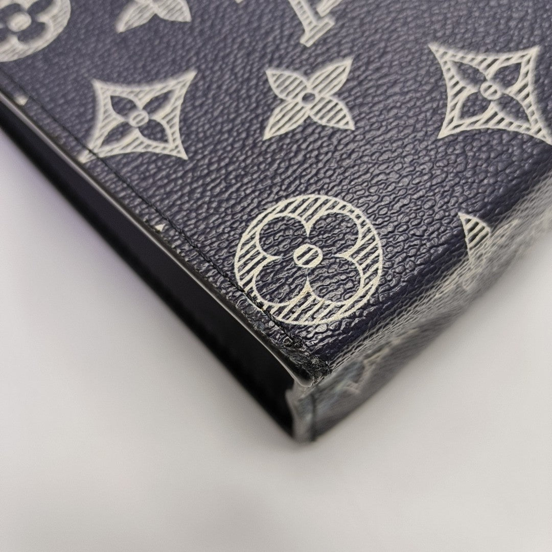 Pochette Voyag MM Monogram Coated Canvas Blue