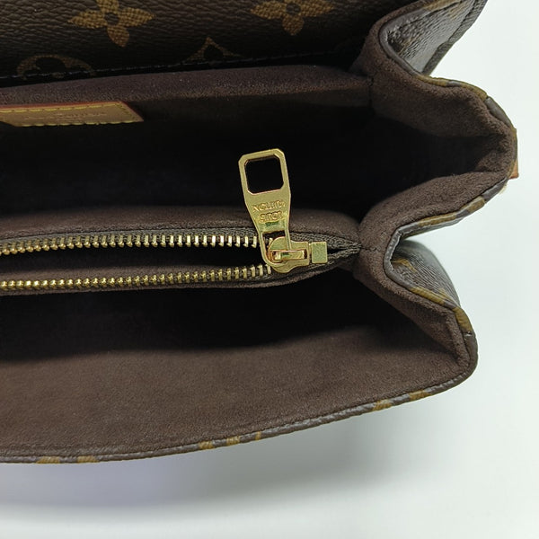 MÉTIS EAST WEST Monogram Coated Canvas Brown