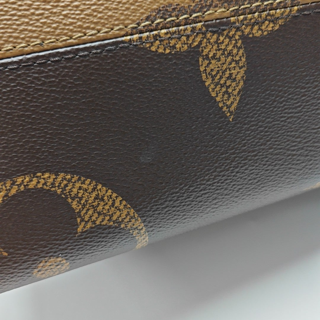 ONTHEGO MM Monogram Coated Canvas Brown