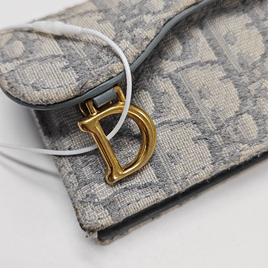 Monedero Saddle de lona Monogram gris