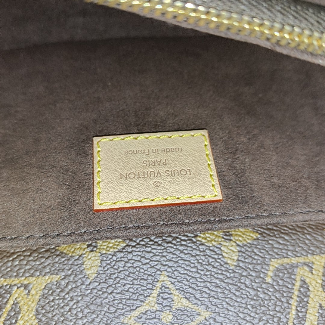 MÉTIS EAST WEST Monogram Coated Canvas Brown