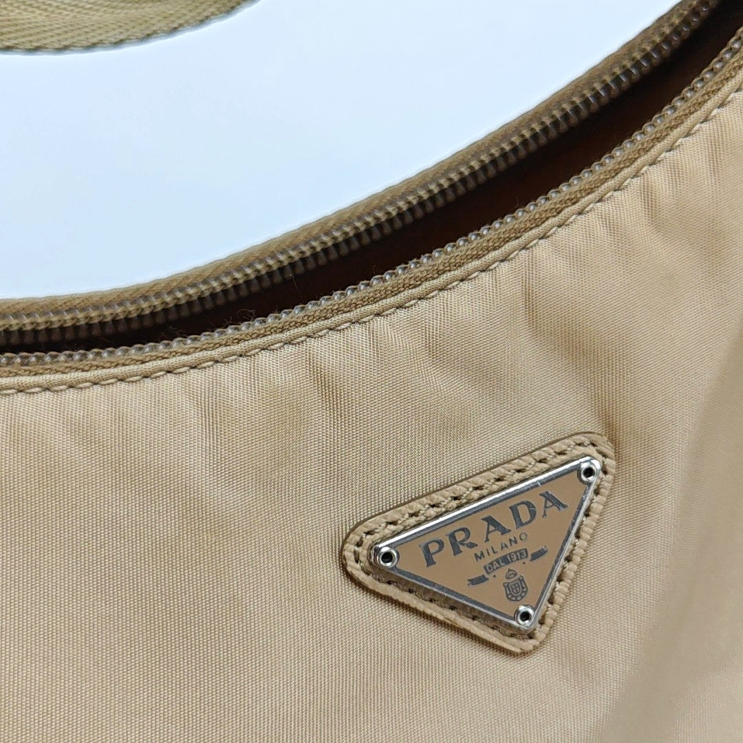 Authenticated pre-owned  Re-Edition2000 Mini Nylon Beige - Top Handle Bag at Looply