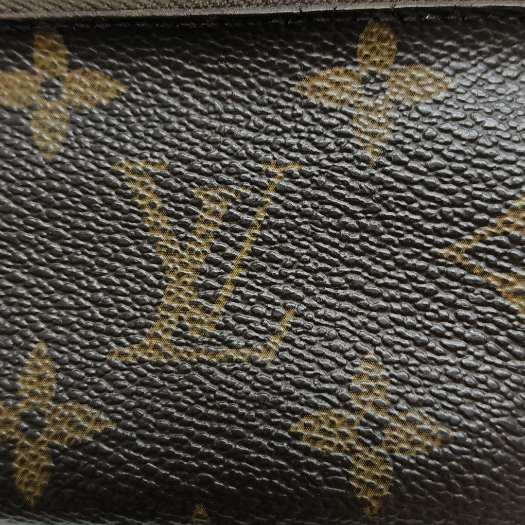 Monogram Coated Canvas Clutch Brown