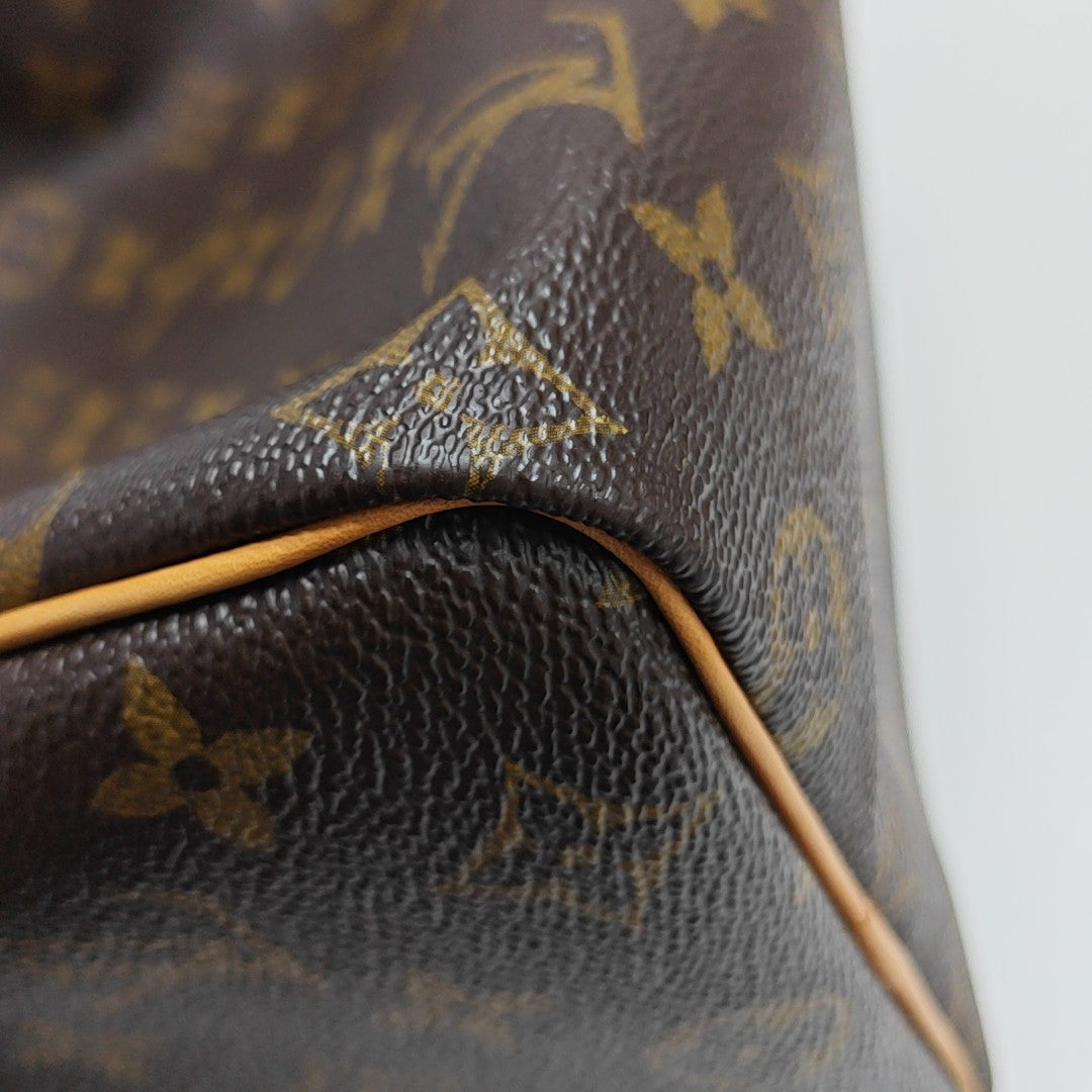 SPEEDY 25 Monogram Coated Canvas Brown