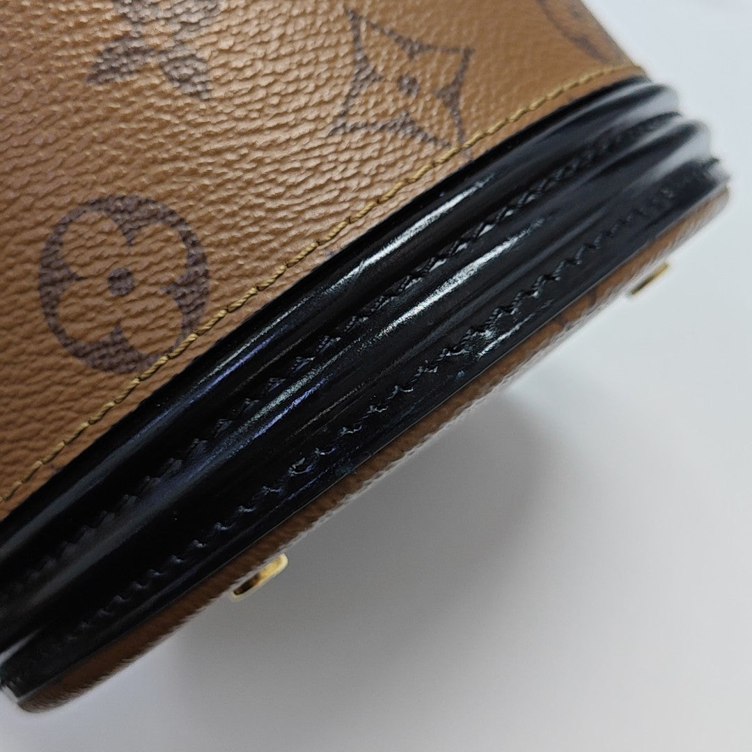 CANNES PM Monogram Coated Canvas Brown