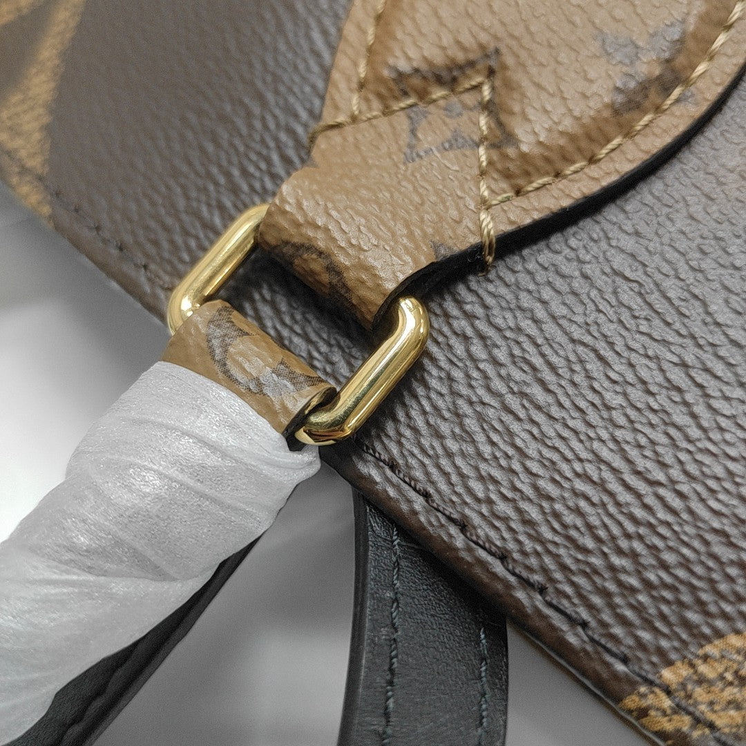 ONTHEGO MM Monogram Coated Canvas Brown