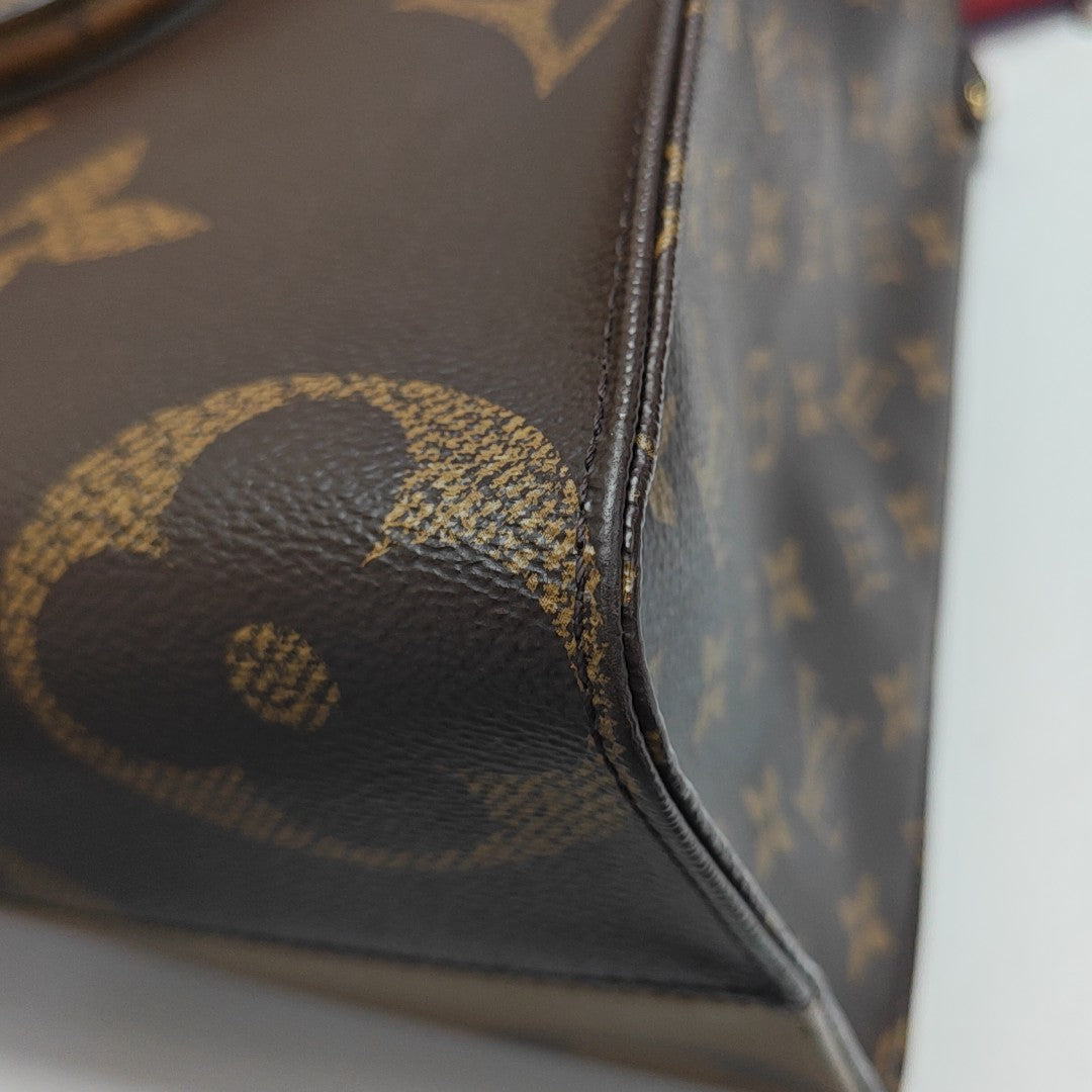 ONTHEGO MM Monogram Coated Canvas Brown