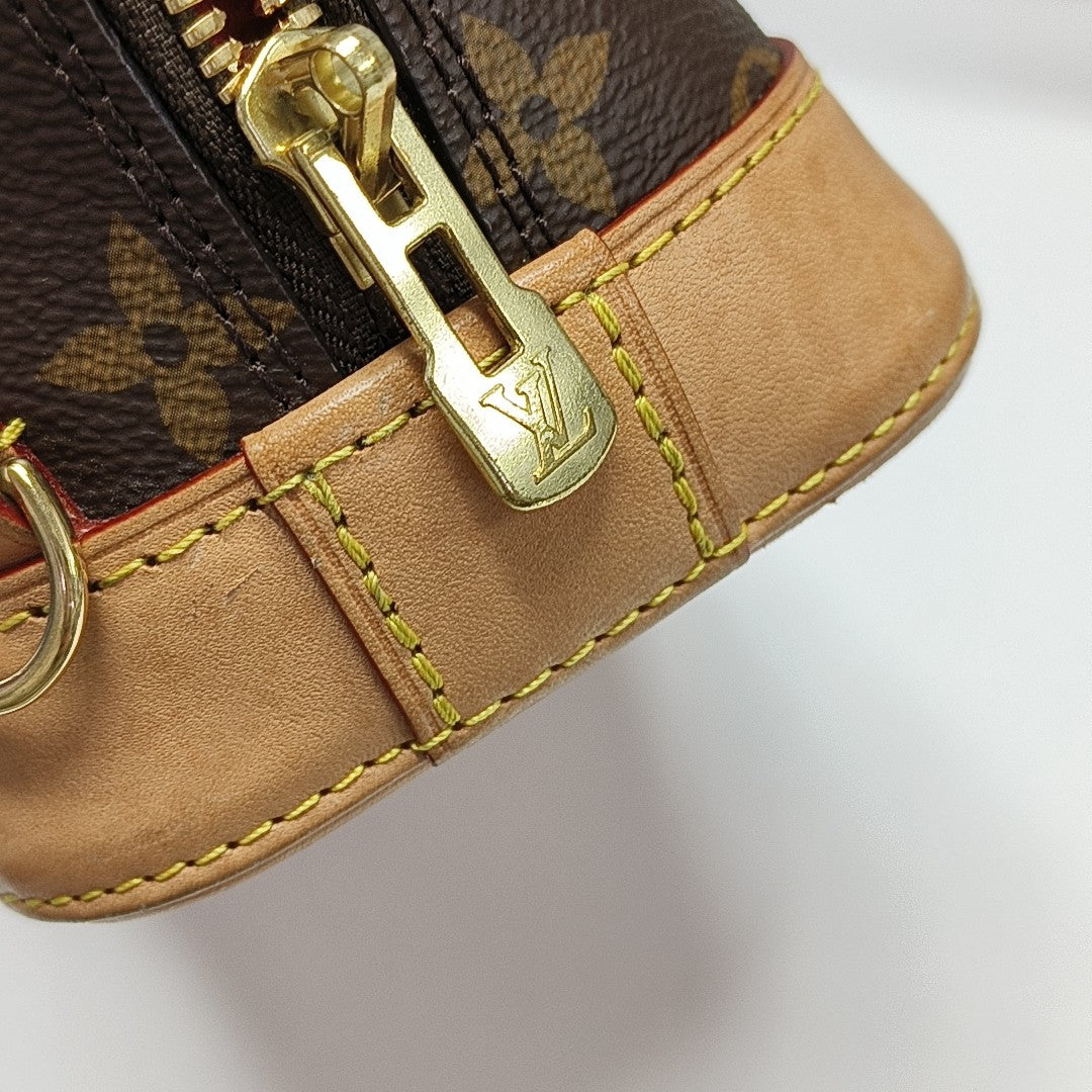 ALMA Mini Monogram Coated Canvas Brown