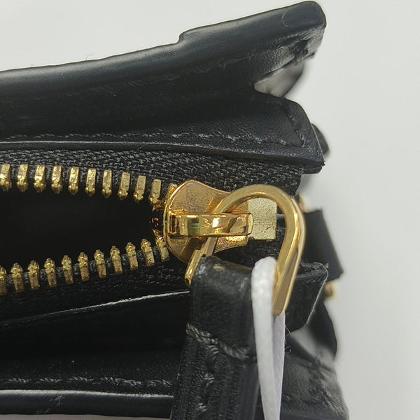 TRUNK Monogram Coated Canvas Brown