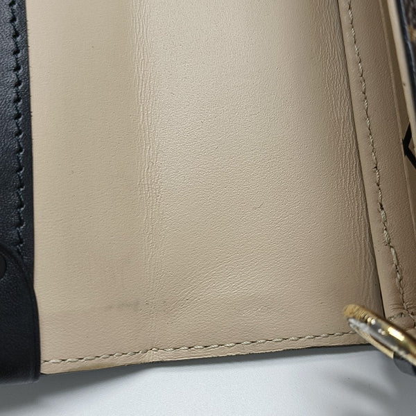 TRUNK Monogram Coated Canvas Brown
