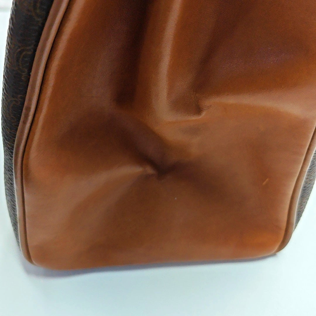 Authenticated pre-owned  MACADAM BLASON TRIOMPHE Coated Canvas Brown - Top Handle Bag at Looply