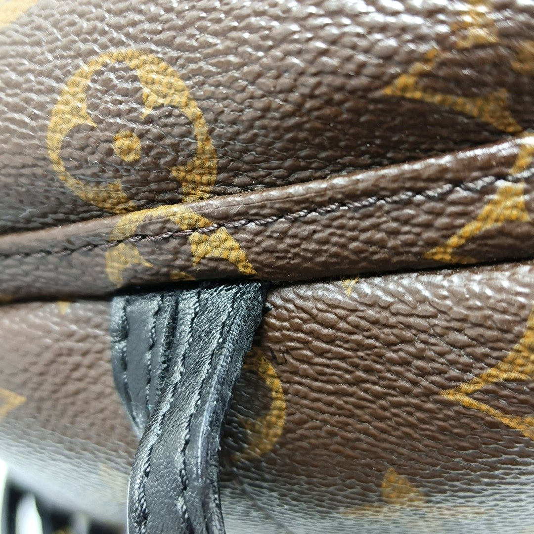 Authenticated pre-owned  PALM SPRINGS Mini Monogram Coated Canvas Brown - Backpack at Looply