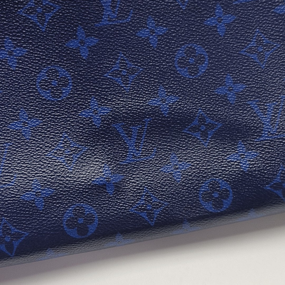 Pochette Voyag MM Monogram Coated Canvas Blue