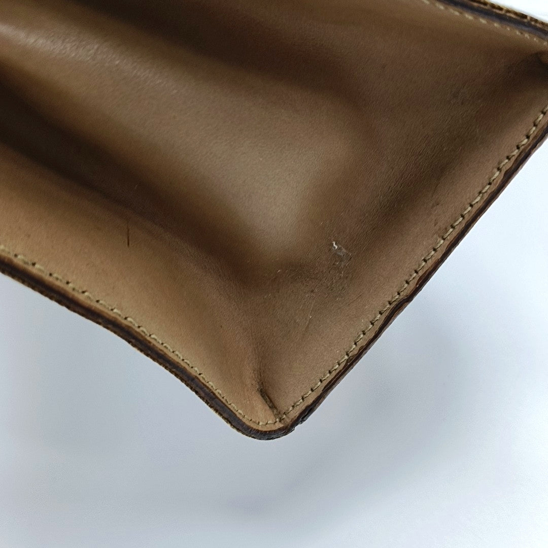 Authenticated pre-owned  MACADAM BLASON TRIOMPHE Coated Canvas Brown - Top Handle Bag at Looply