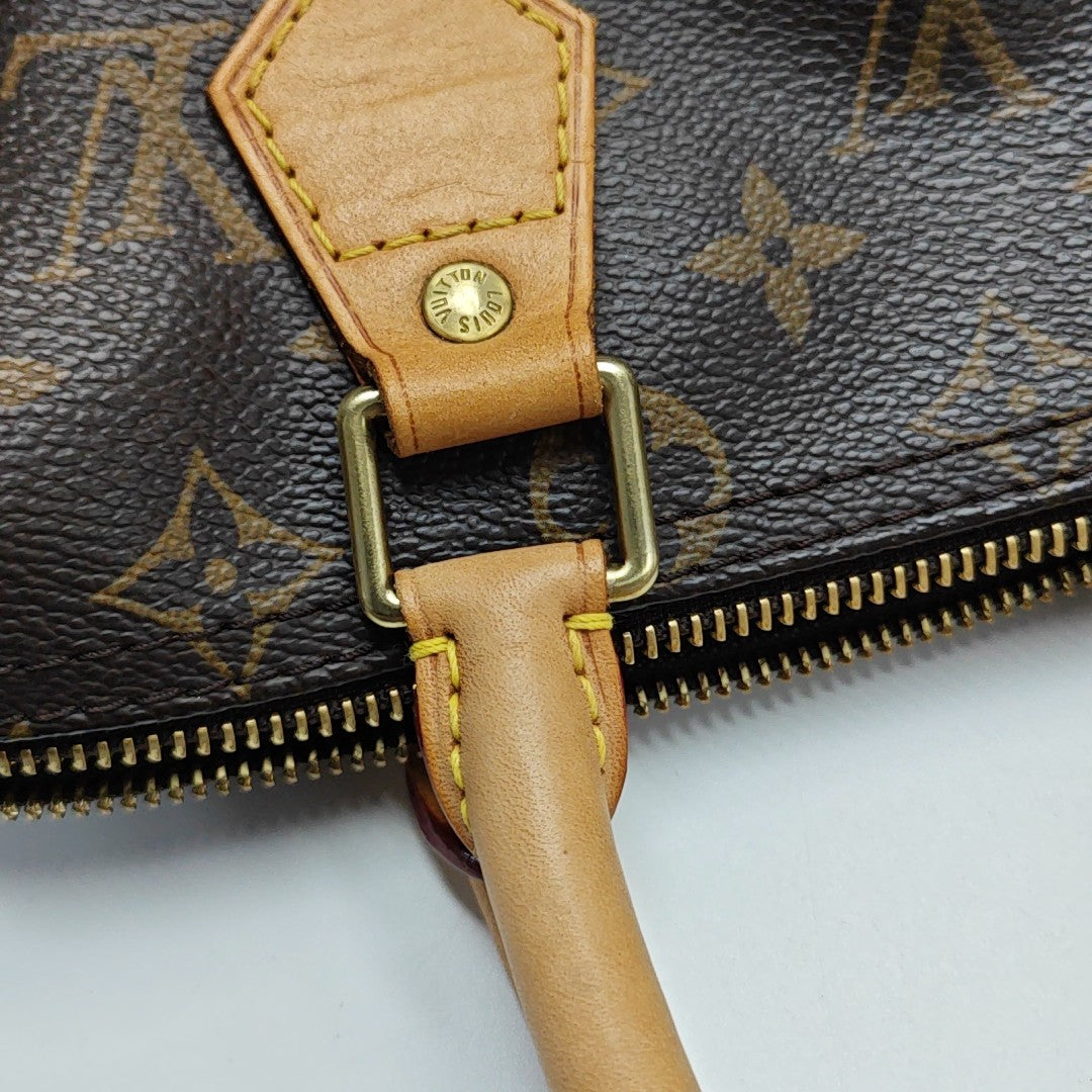 SPEEDY 25 Monogram Coated Canvas Brown