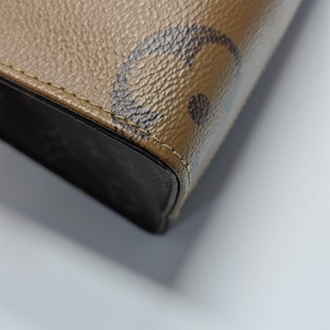 ONTHEGO PM Monogram Coated Canvas Brown