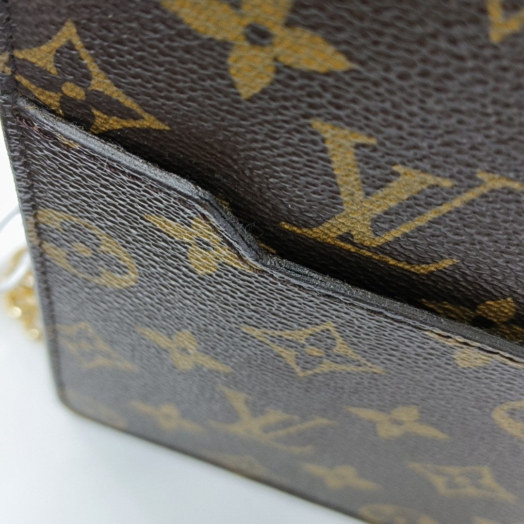Monogram Coated Canvas Clutch Brown