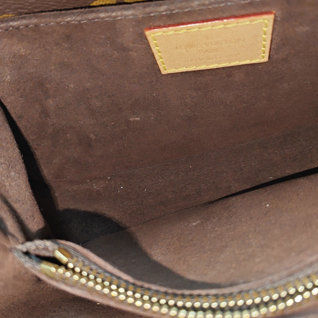 MÉTIS EAST WEST Monogram Coated Canvas Brown