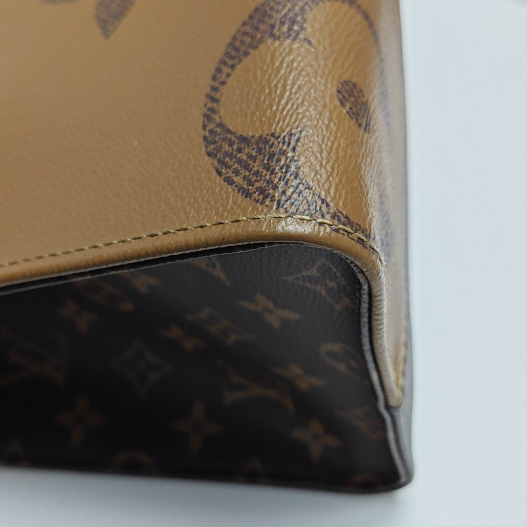 ONTHEGO MM Monogram Coated Canvas Brown