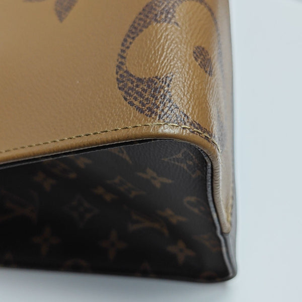 ONTHEGO MM Monogram Coated Canvas Brown