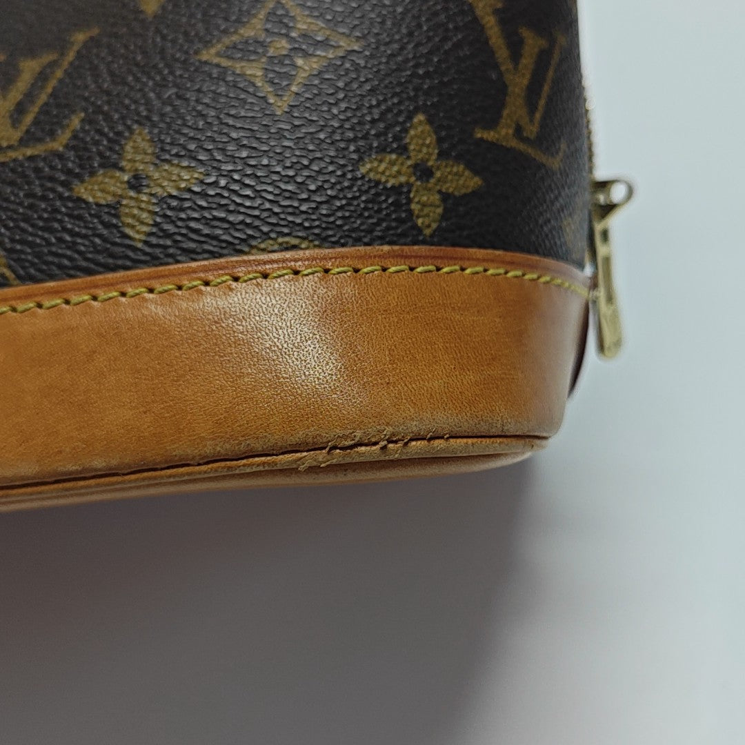 ALMA PM Monogram Coated Canvas Brown