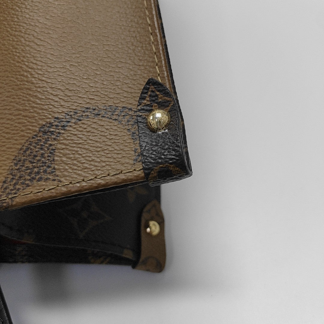 ONTHEGO MM Monogram Coated Canvas Brown