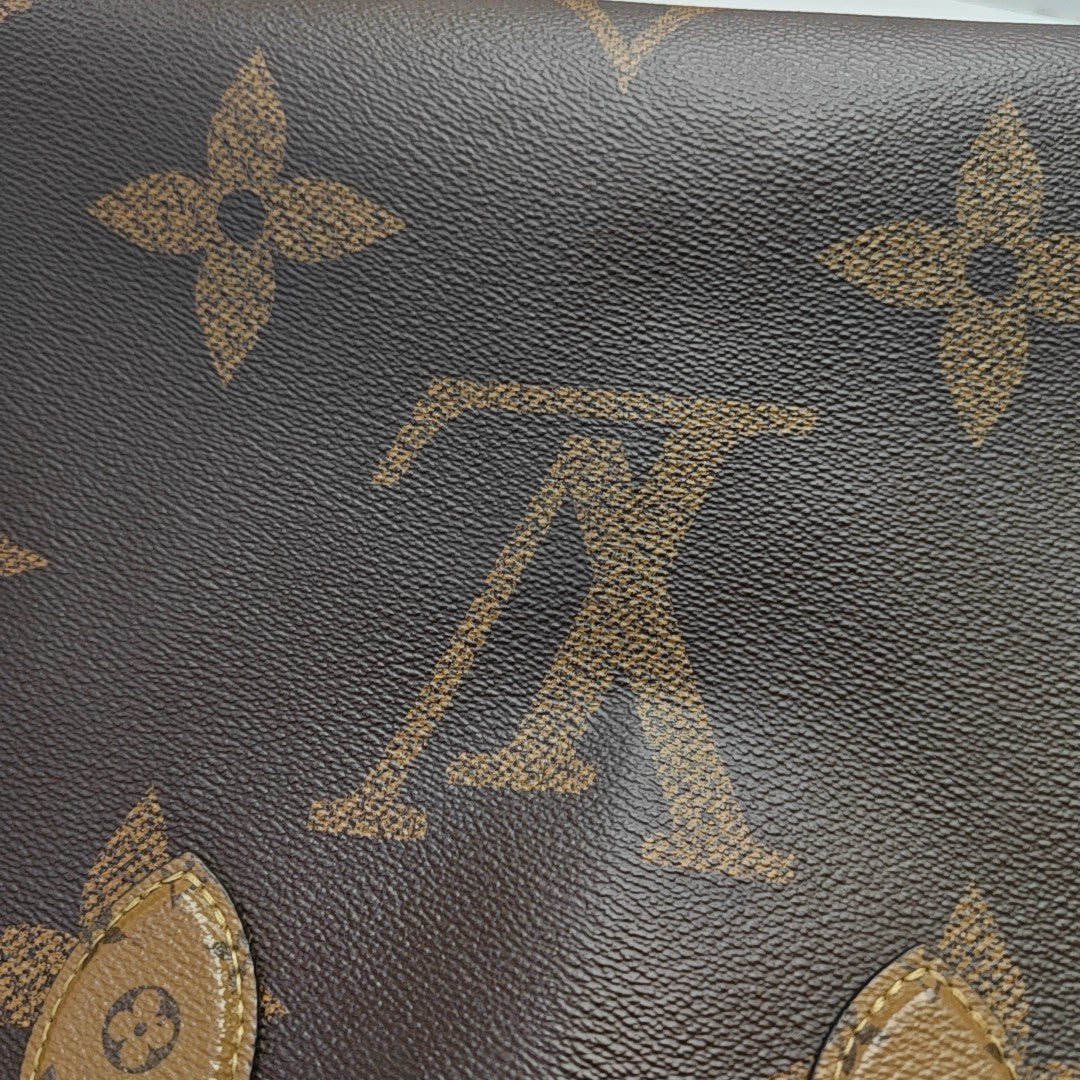 ONTHEGO MM Monogram Coated Canvas Brown