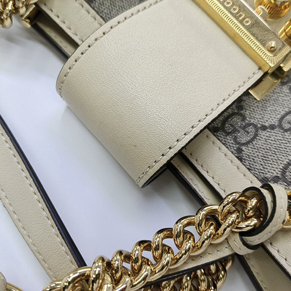 Padlock Small Monogram Coated Canvas Beige