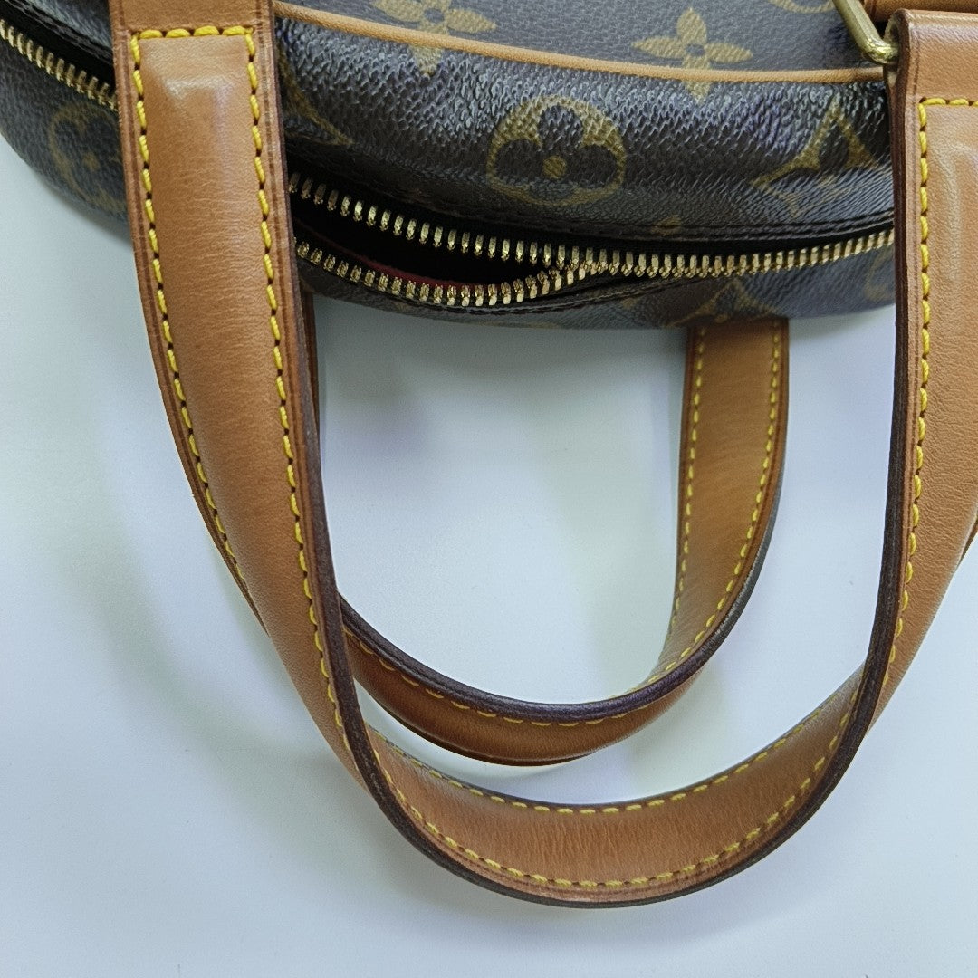 EXCENTRI-CITE Monogram Coated Canvas Brown