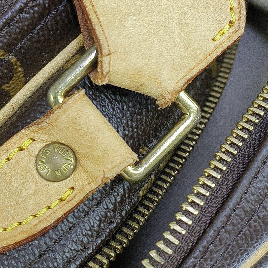 REPORTER PM Monogram Coated Canvas Brown