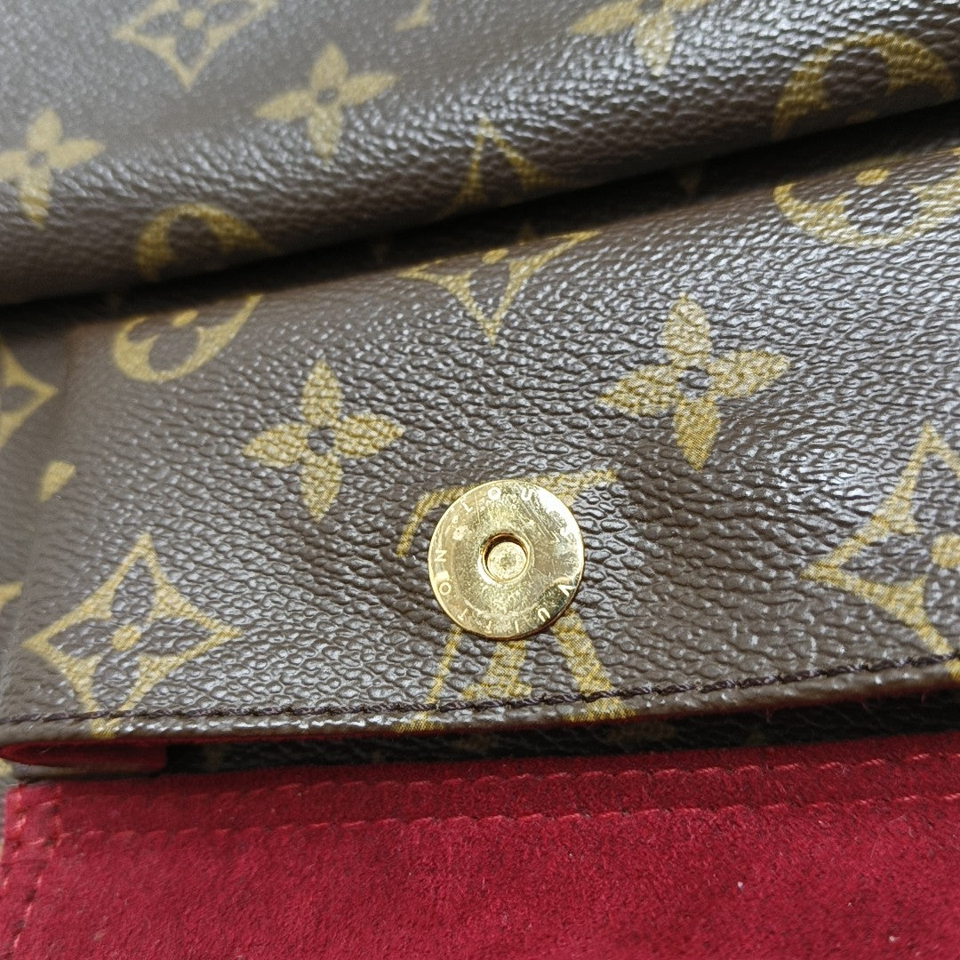 EXCENTRI-CITE Monogram Coated Canvas Brown