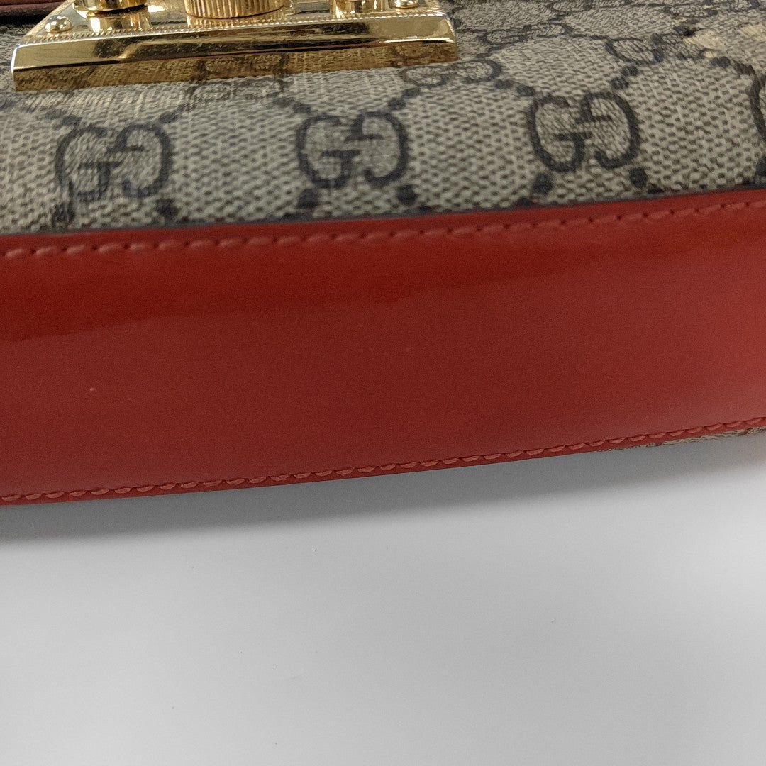 Candado pequeño Monogram lona revestida beige