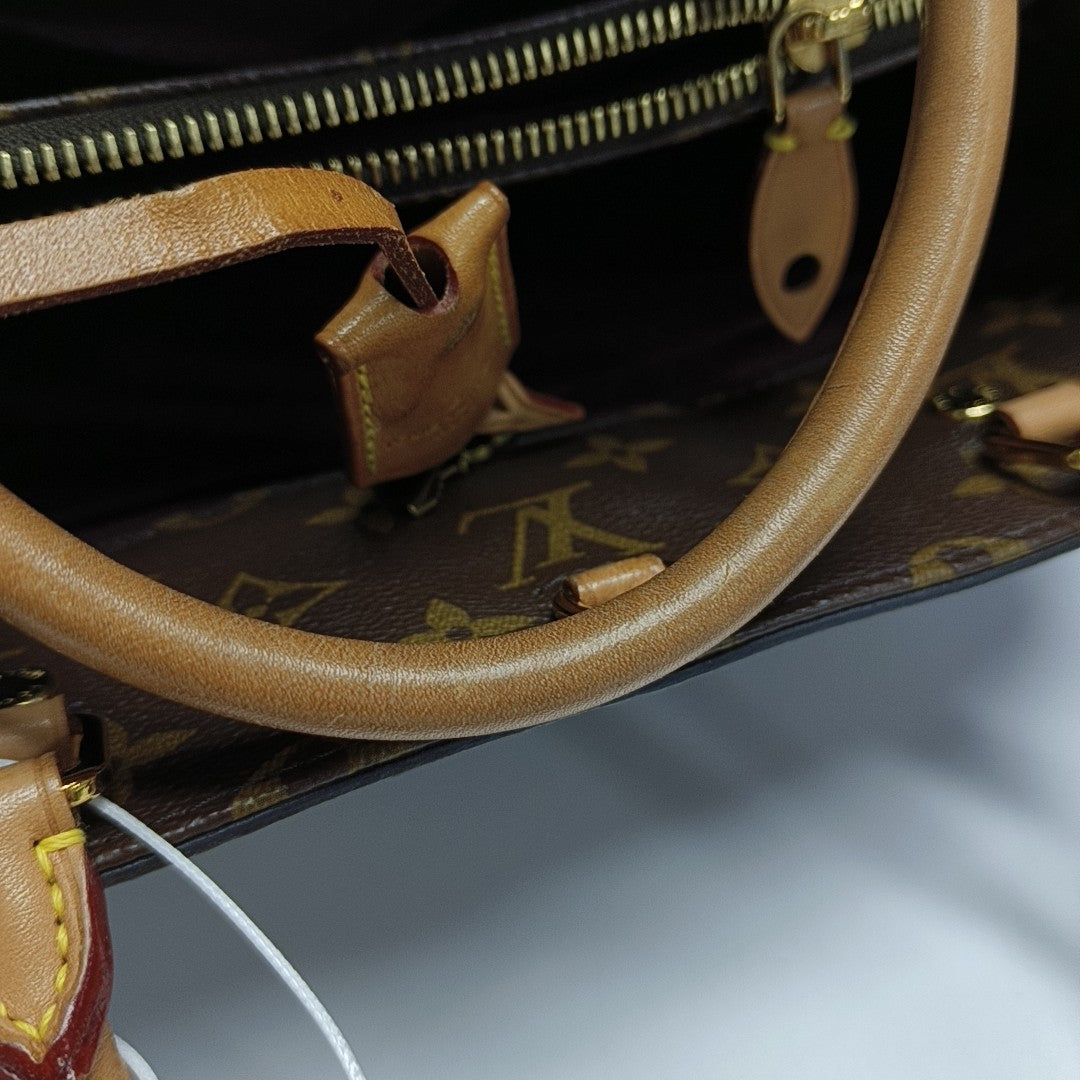 MONTAIGNE MM Monogram Coated Canvas Brown