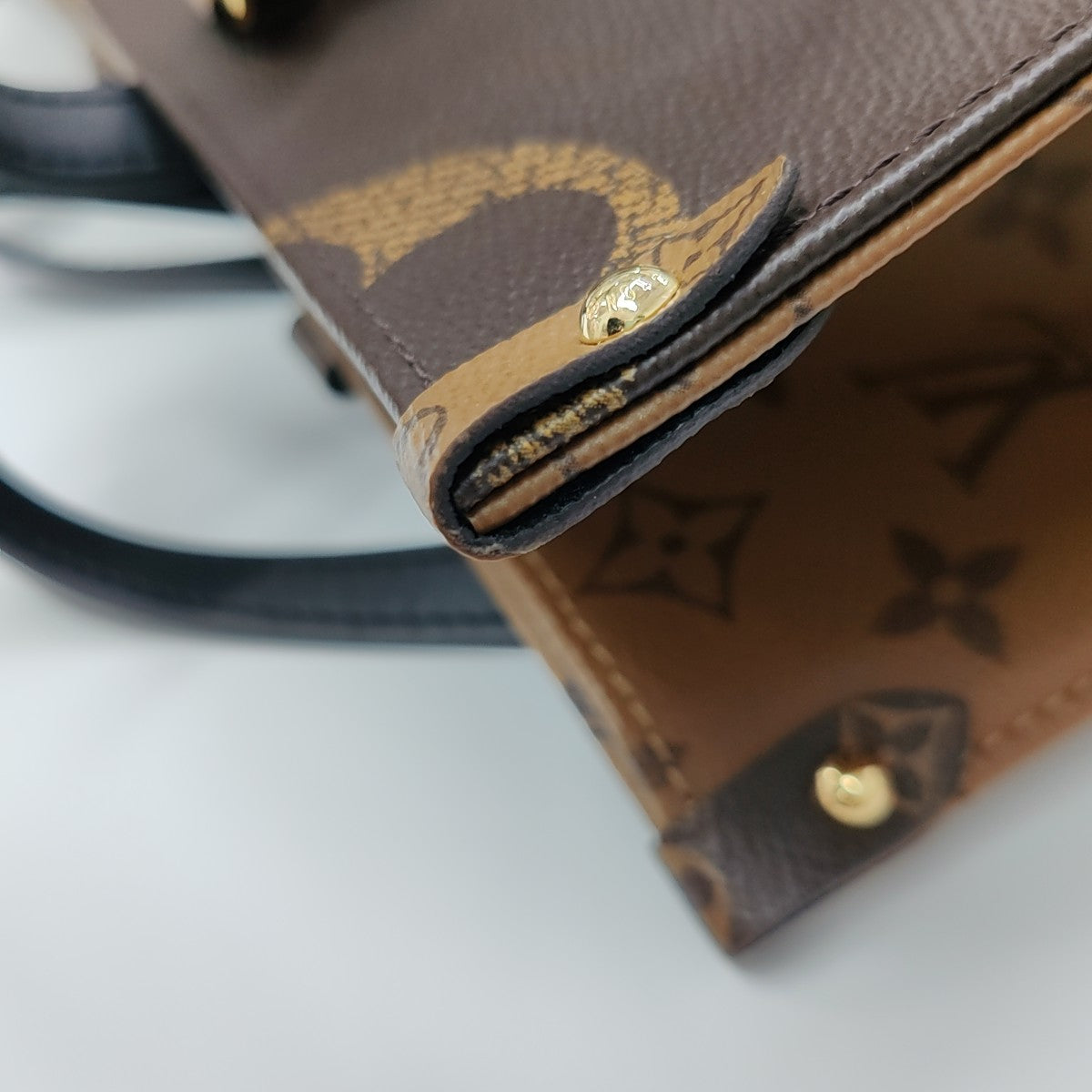 ONTHEGO MM Monogram Coated Canvas Brown