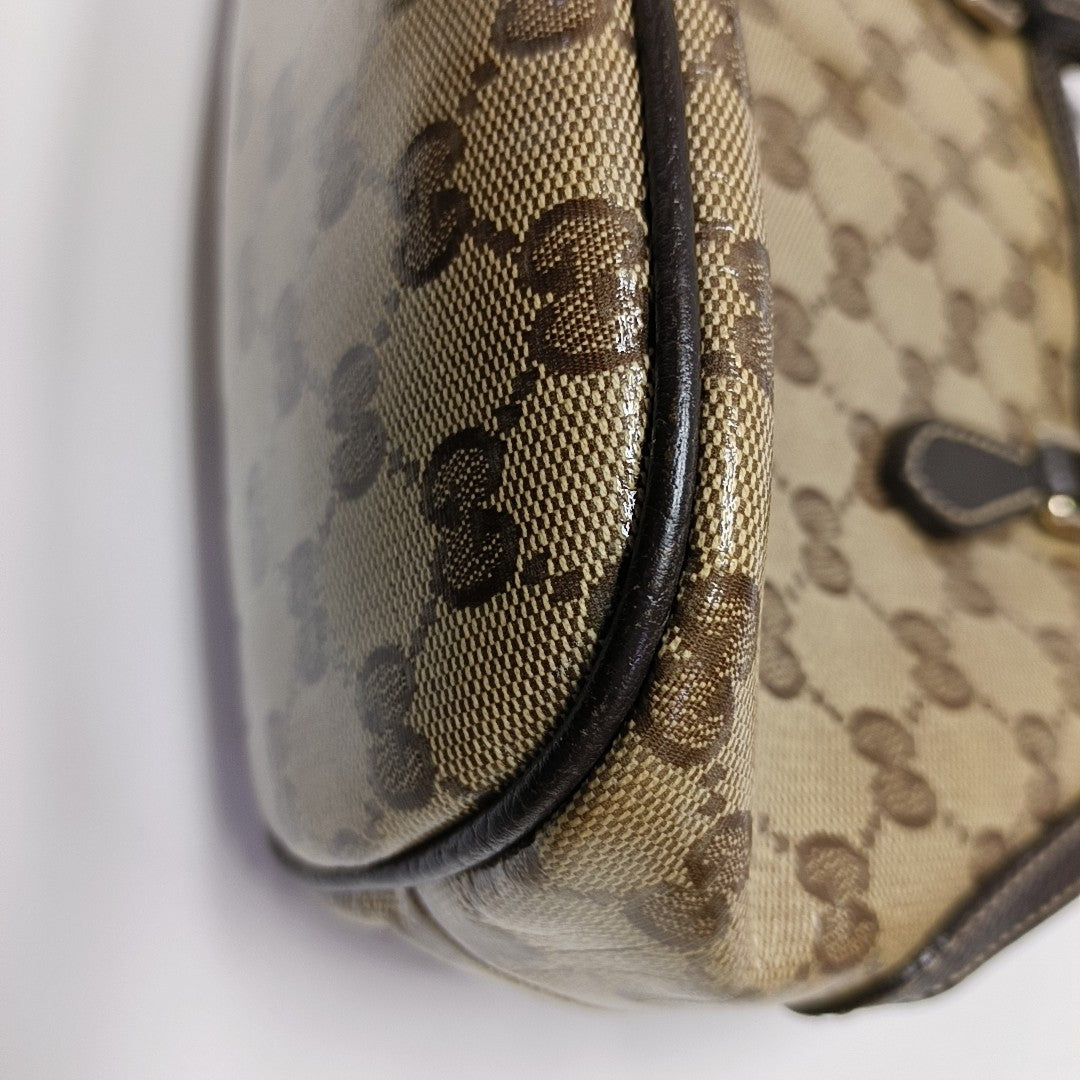 Dome Monogram Coated Canvas Brown