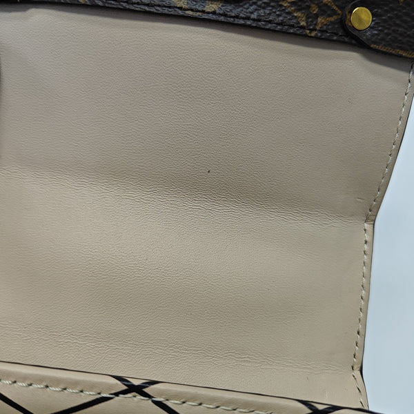 TRUNK Monogram Coated Canvas Brown