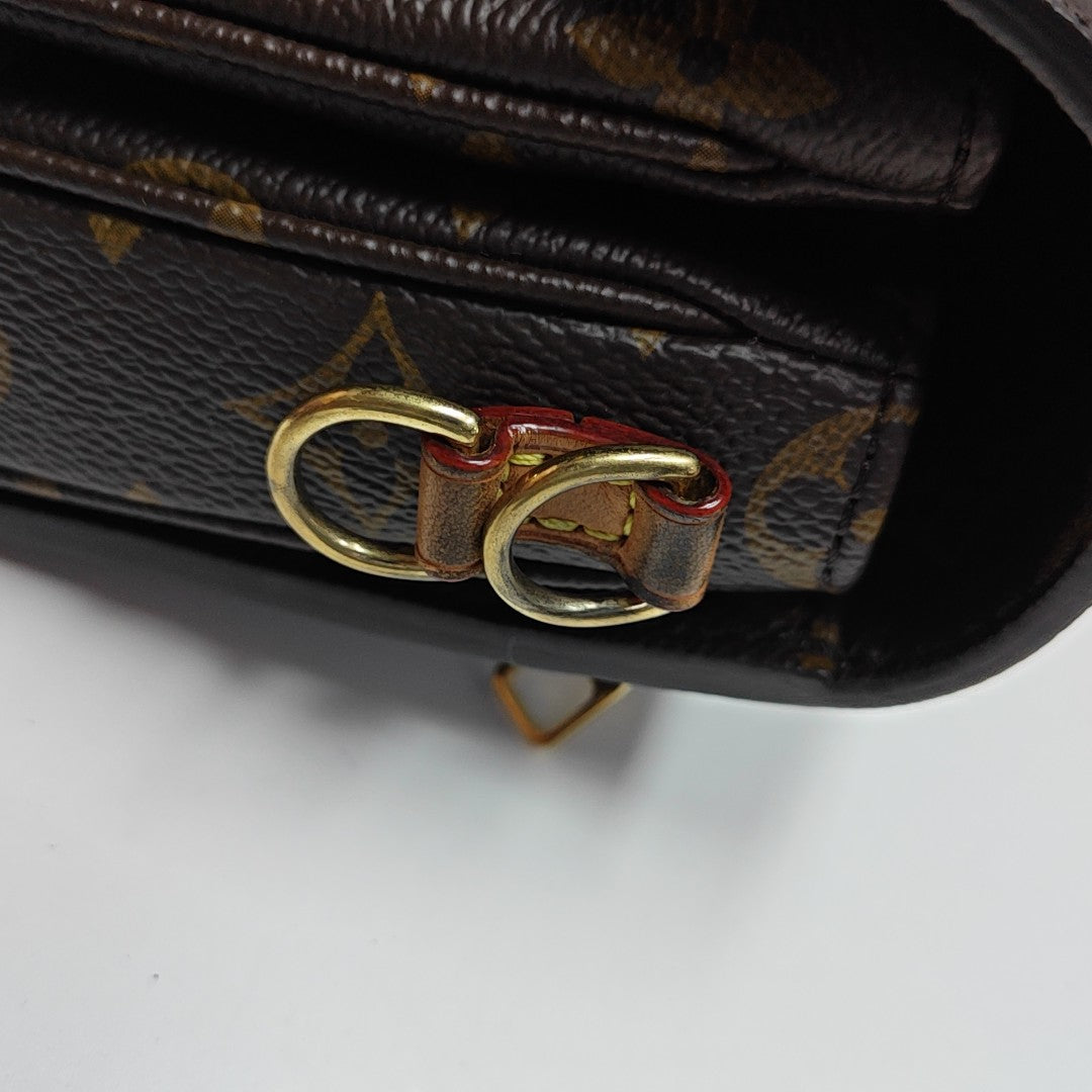 MÉTIS EAST WEST Monogram Coated Canvas Brown