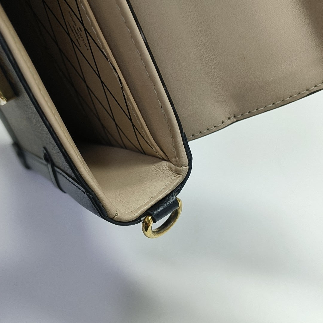 TRUNK Monogram Coated Canvas Brown