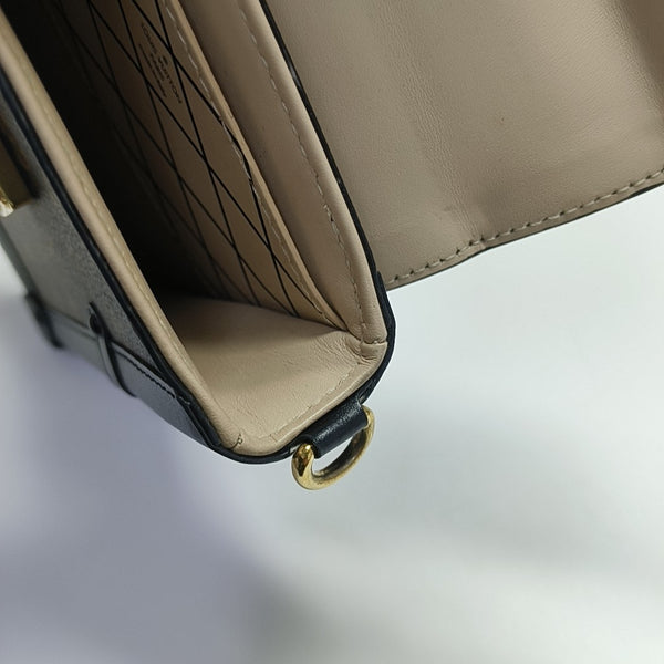 TRUNK Monogram Coated Canvas Brown