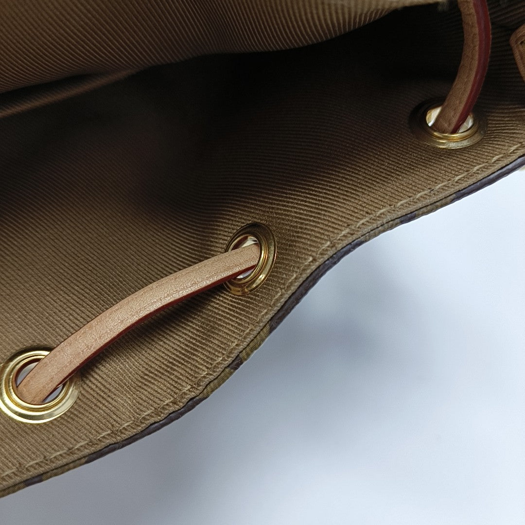 EXCURSION PM Monogram Coated Canvas Brown