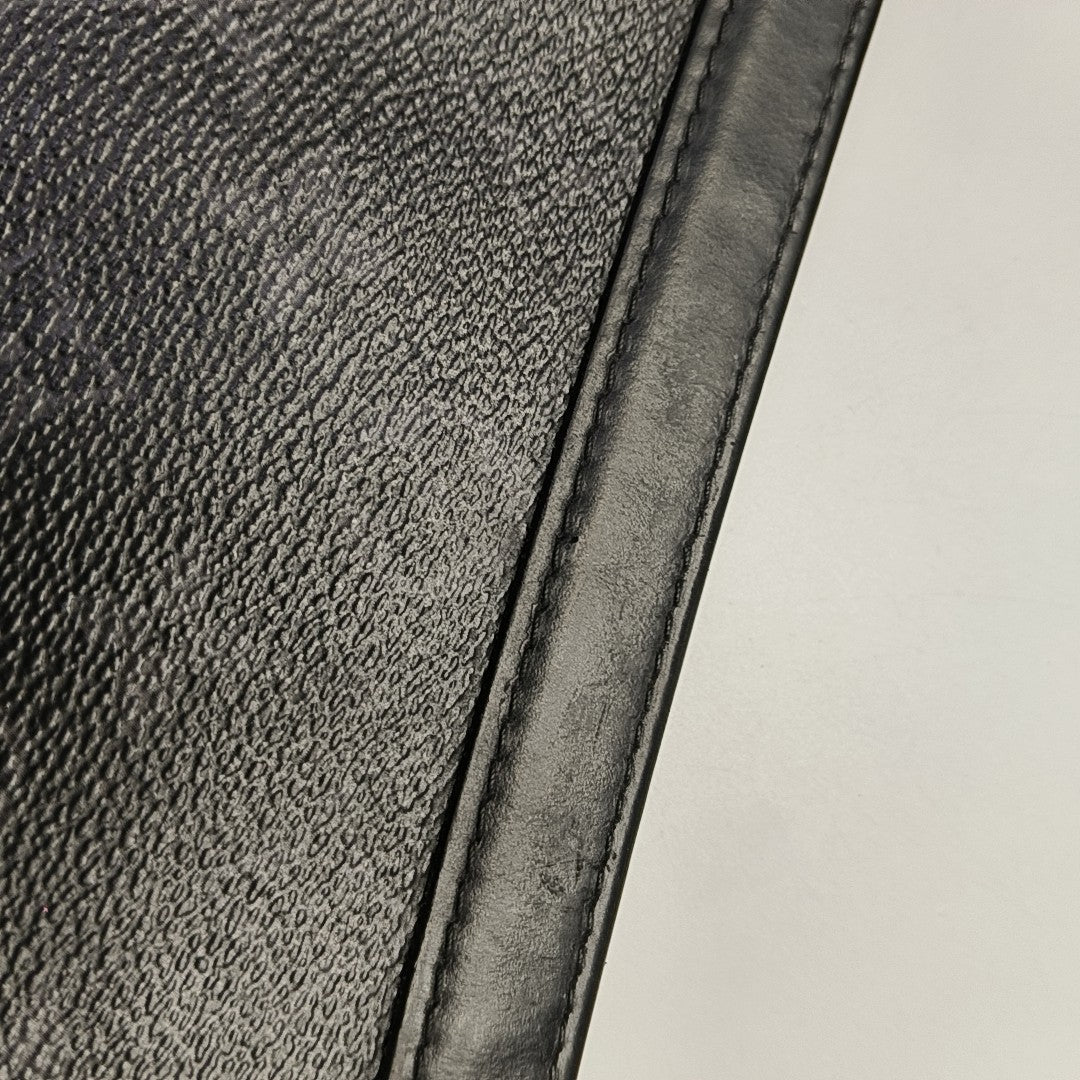 Pochette Voyag MM Monogram Coated Canvas Black
