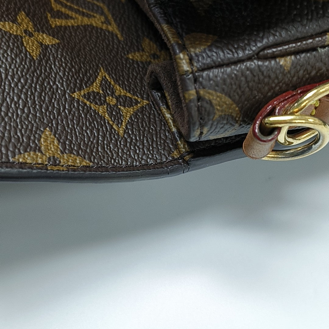 MÉTIS EAST WEST Monogram Coated Canvas Brown