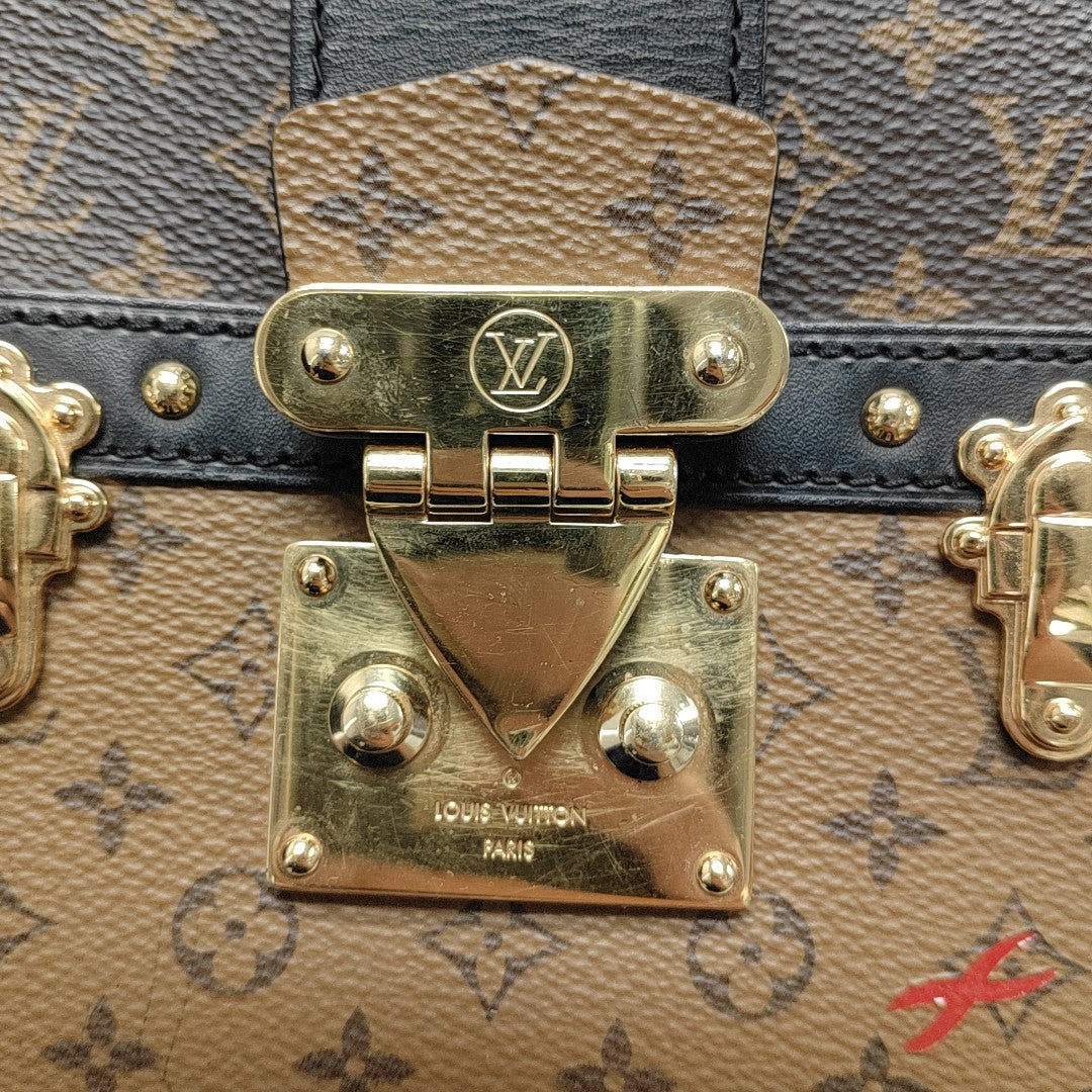 TRUNK Monogram Coated Canvas Brown