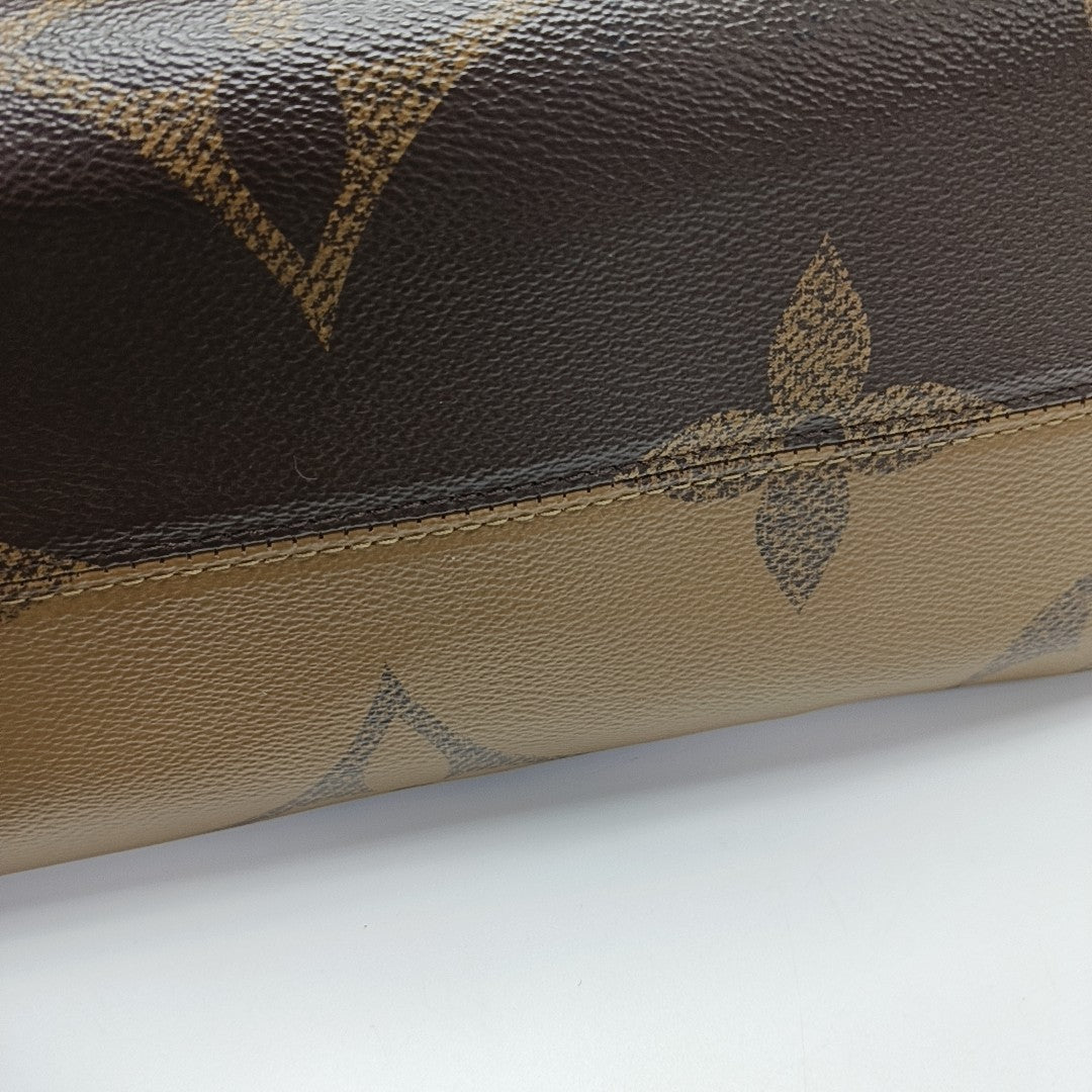 ONTHEGO MM Monogram Coated Canvas Brown