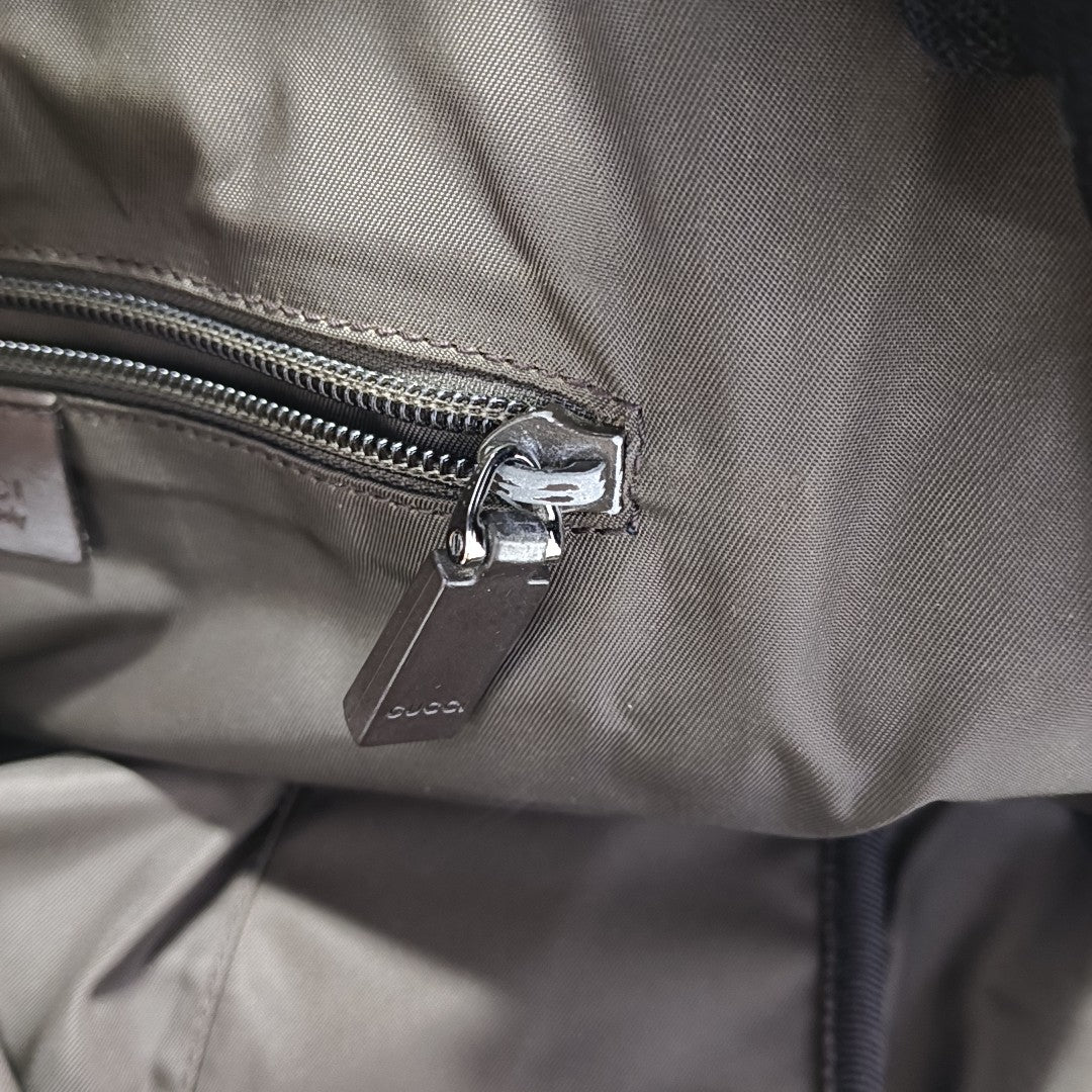 Monogram Coated Canvas Backpack Brown