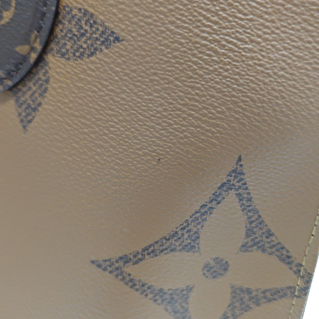 ONTHEGO MM Monogram Coated Canvas Brown