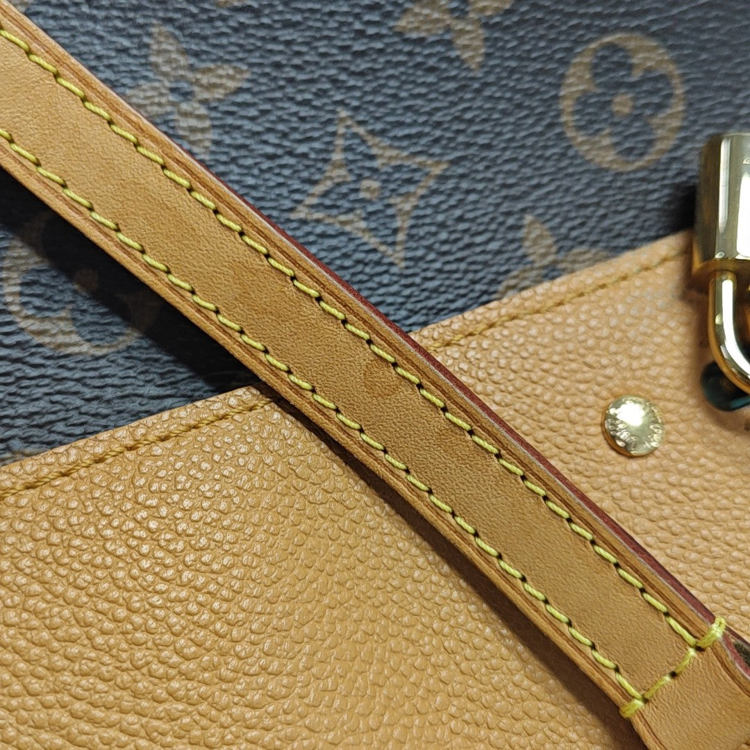 VÉNUS Monogram Coated Canvas Brown
