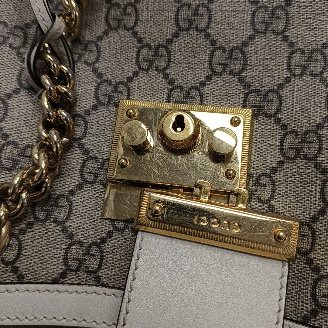 Padlock Small Monogram Coated Canvas Beige